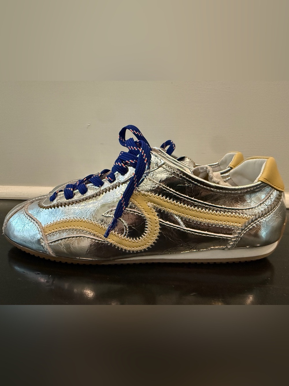 Sandro Paris Metallic Silver Sneaker with Yellow Accents and Navy Laces.